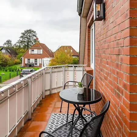 Апартаменты Huebsche Ferienwohnung In Nessmersiel, Mit Balkon, Wlan, Haustiere Gestattet. Несмерзиль